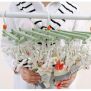 Plastic folding clothes hanger-29 clips -green